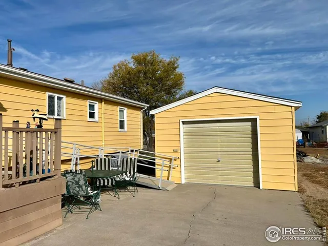 a backyard of a house with yard and seating space