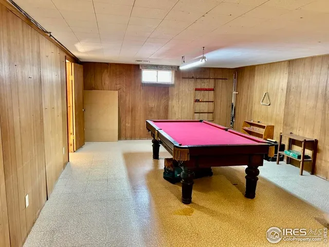 a bedroom with a bed and a table