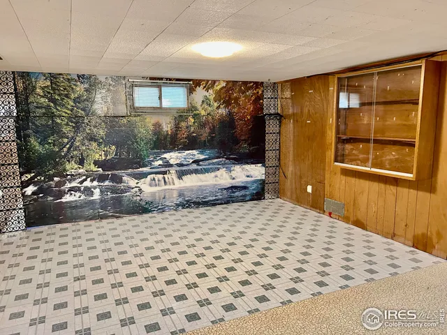 a living room with a couch and a flat screen tv
