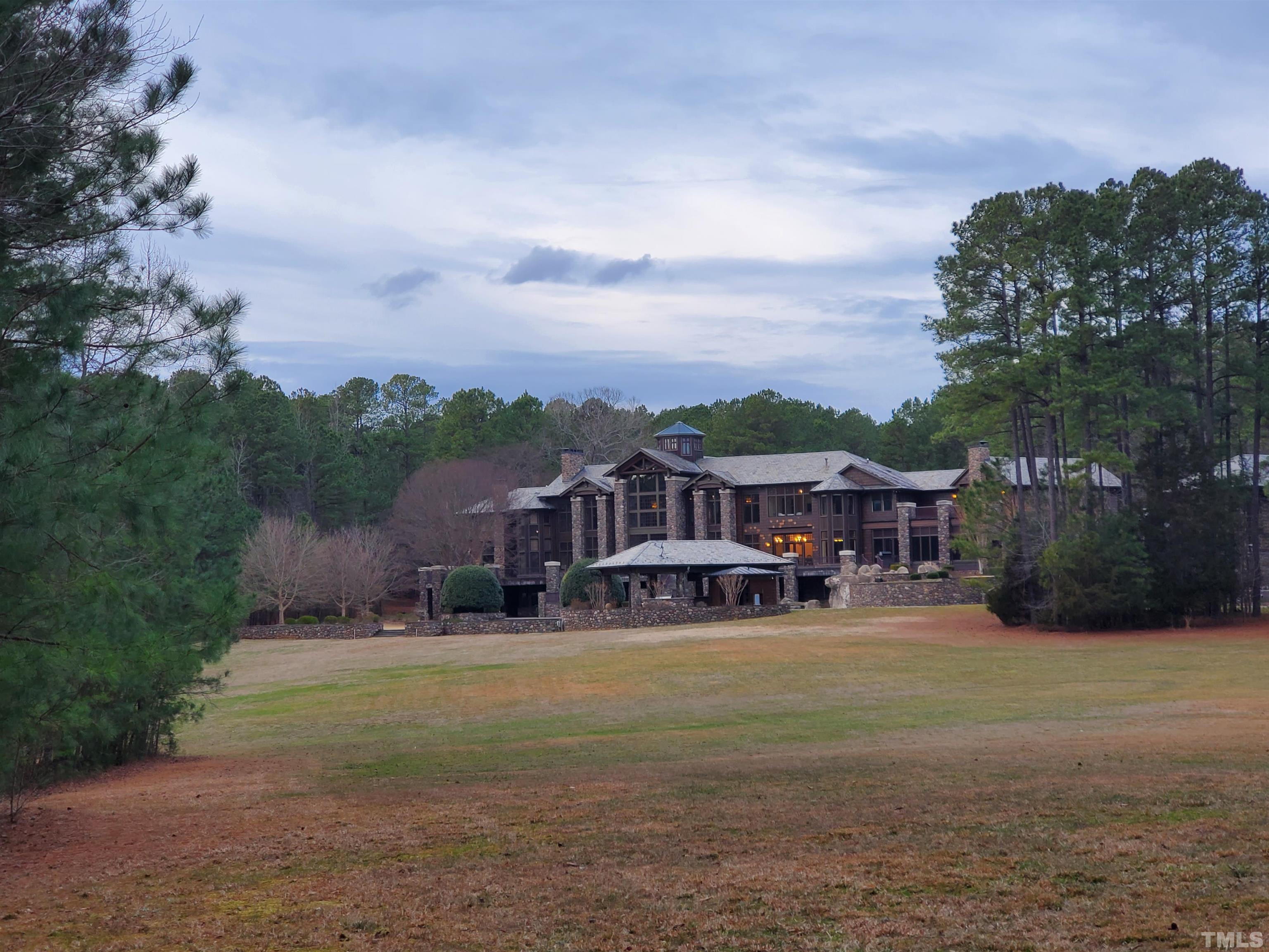 1400 Alpine Creek Drive Raleigh, NC 27614 - Photo 3 of 4 an aerial view of a house with a big yard and large trees