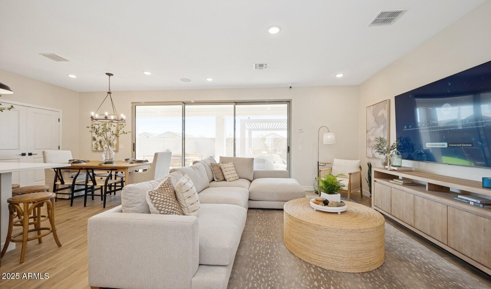 8014 West Royal Palm Road Peoria, AZ 85345 - Photo 10 of 37 a living room with furniture and a large window