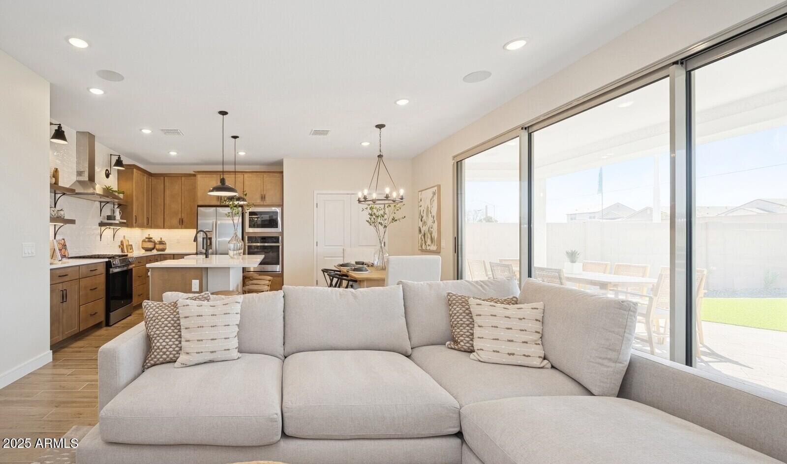 8014 West Royal Palm Road Peoria, AZ 85345 - Photo 12 of 37 a living room with furniture and a large window