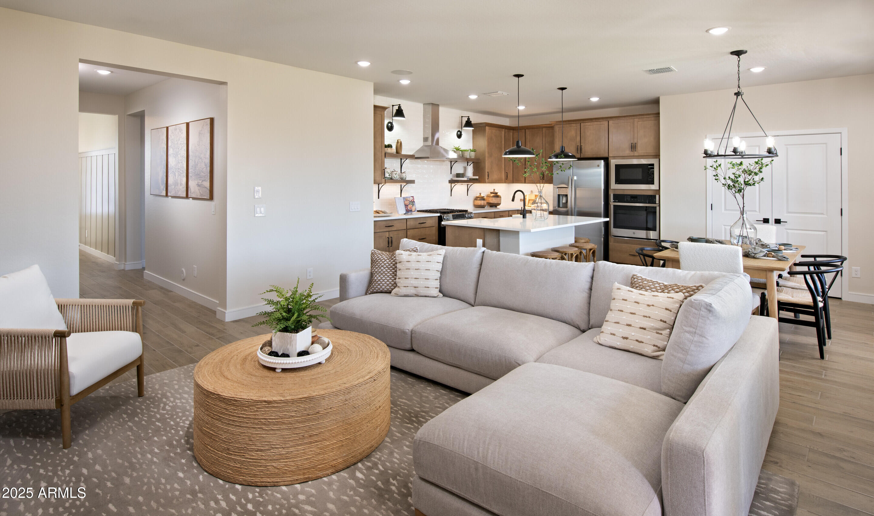 8014 West Royal Palm Road Peoria, AZ 85345 - Photo 13 of 37 a living room with furniture kitchen and a chandelier