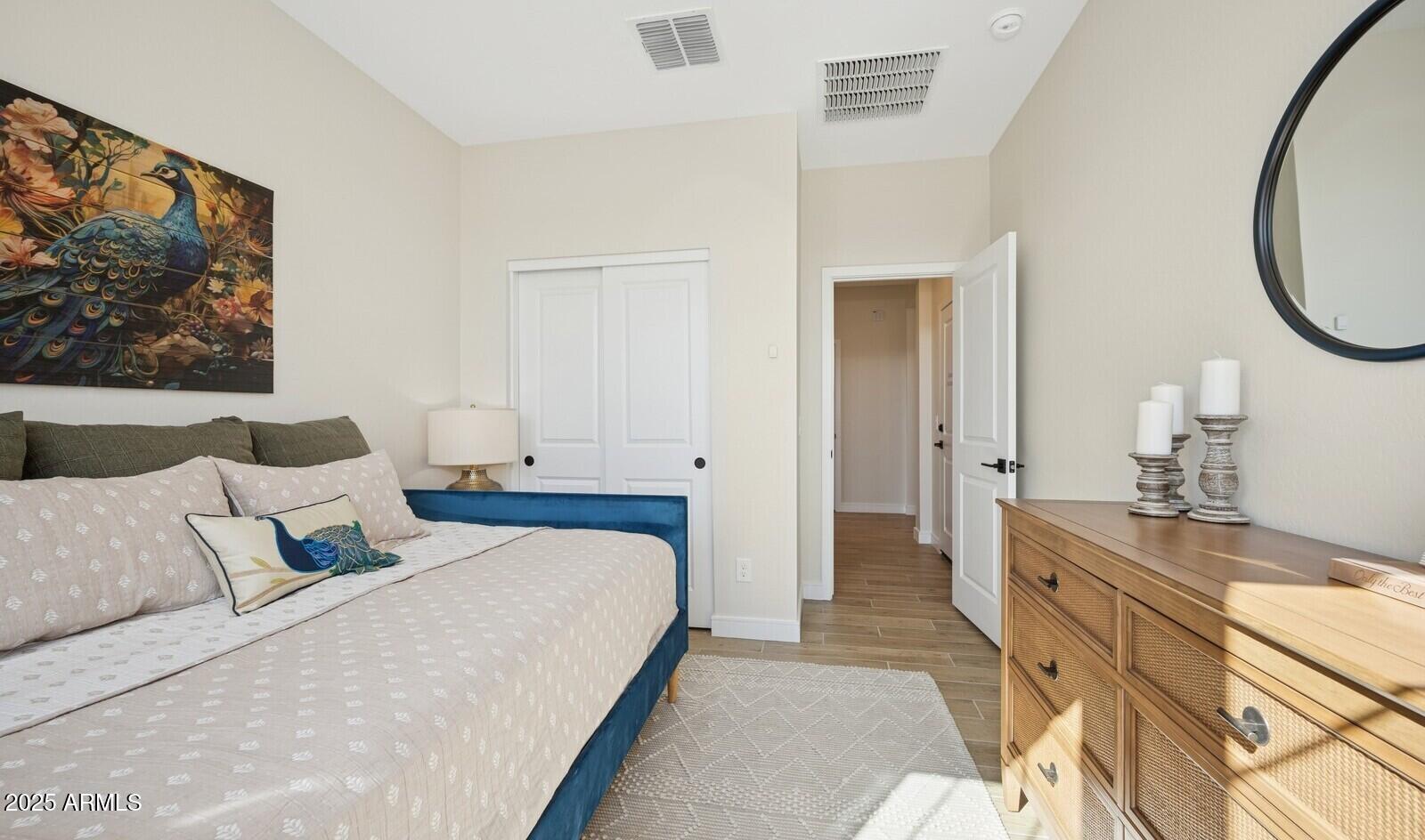 8014 West Royal Palm Road Peoria, AZ 85345 - Photo 15 of 37 a bedroom with a bed and a flat screen tv