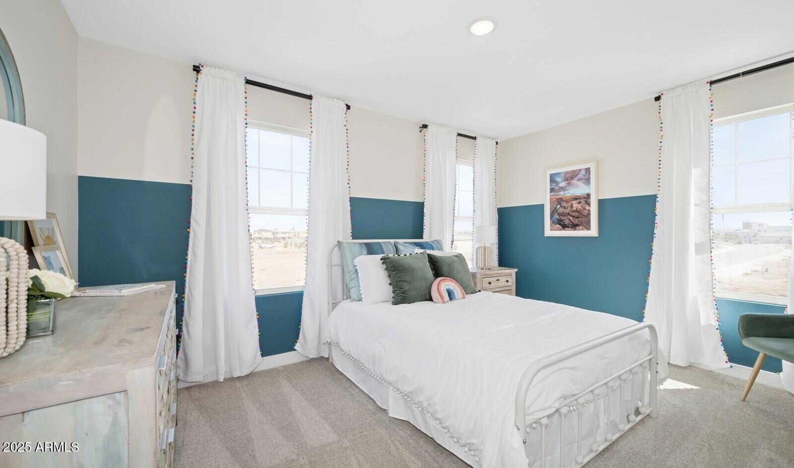 8014 West Royal Palm Road Peoria, AZ 85345 - Photo 26 of 37 a bedroom with a bed and a flat screen tv