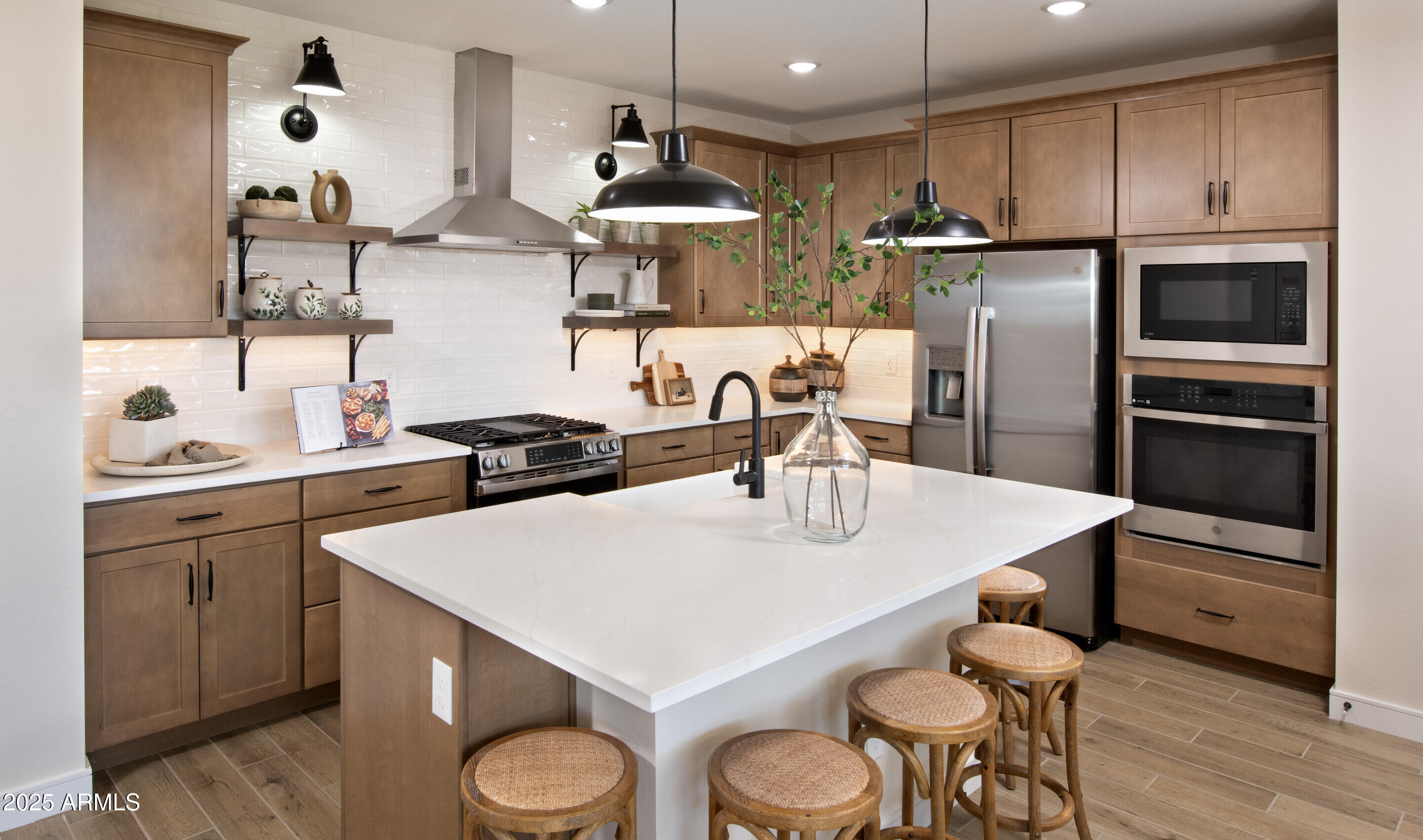 8014 West Royal Palm Road Peoria, AZ 85345 - Photo 2 of 37 a kitchen with a sink a stove and chairs