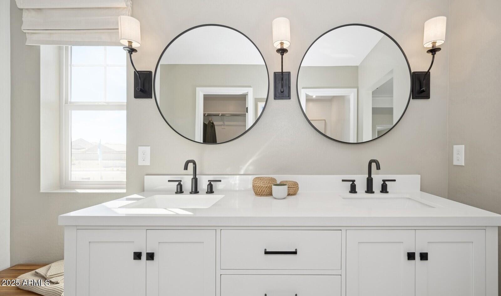8014 West Royal Palm Road Peoria, AZ 85345 - Photo 32 of 37 a bathroom with a sink and a mirror