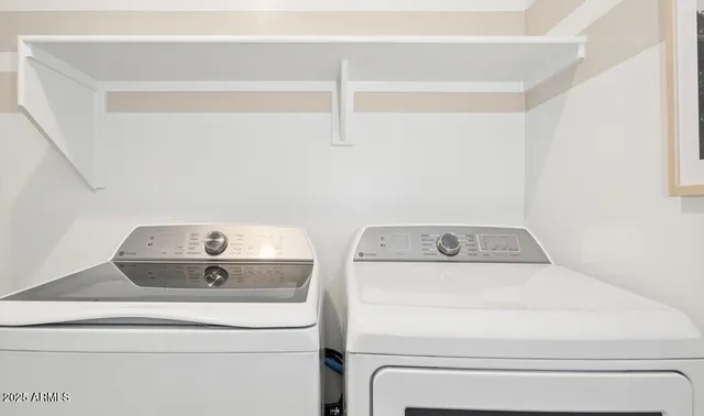 a bathroom with a double vanity sink mirror and a mirror