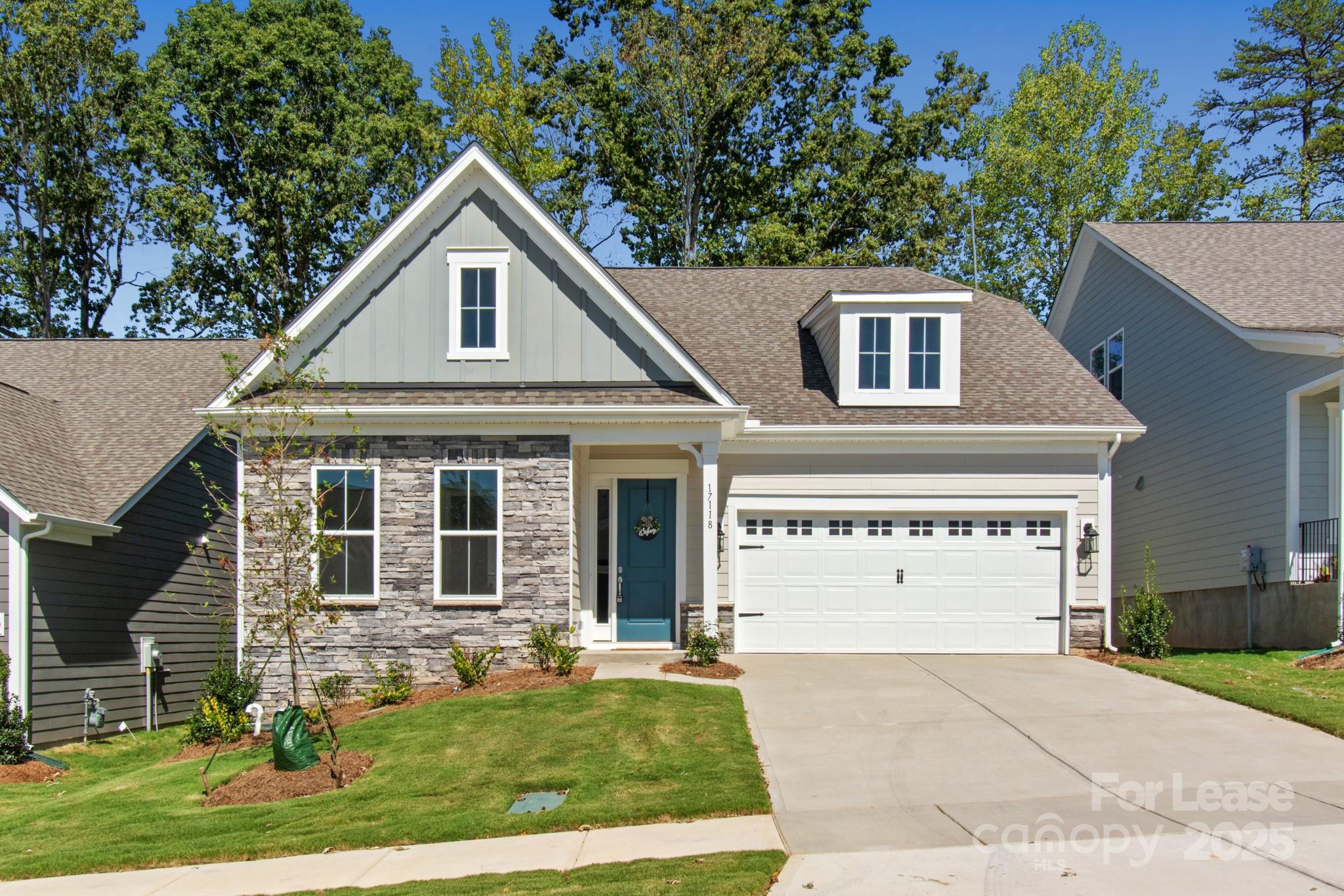 17118 Sand Bank Road Charlotte, NC 28278 - Photo 1 of 37 a front view of a house with a yard