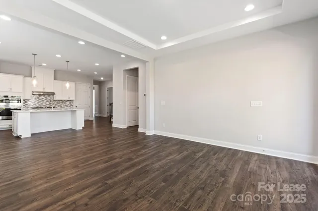 a view of kitchen with wooden floor