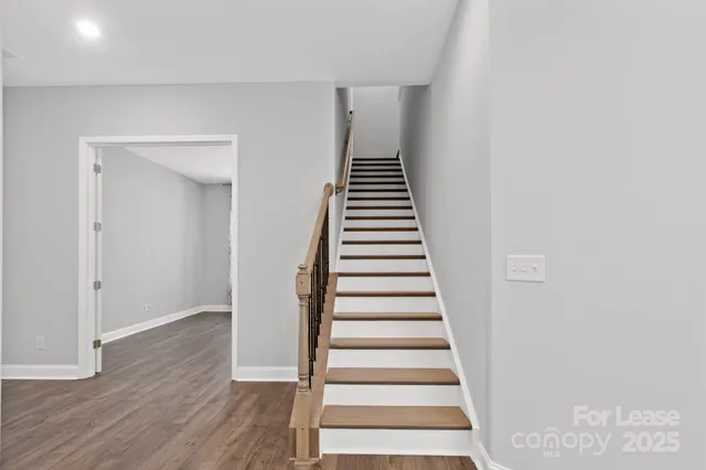 a view of entryway with wooden floor