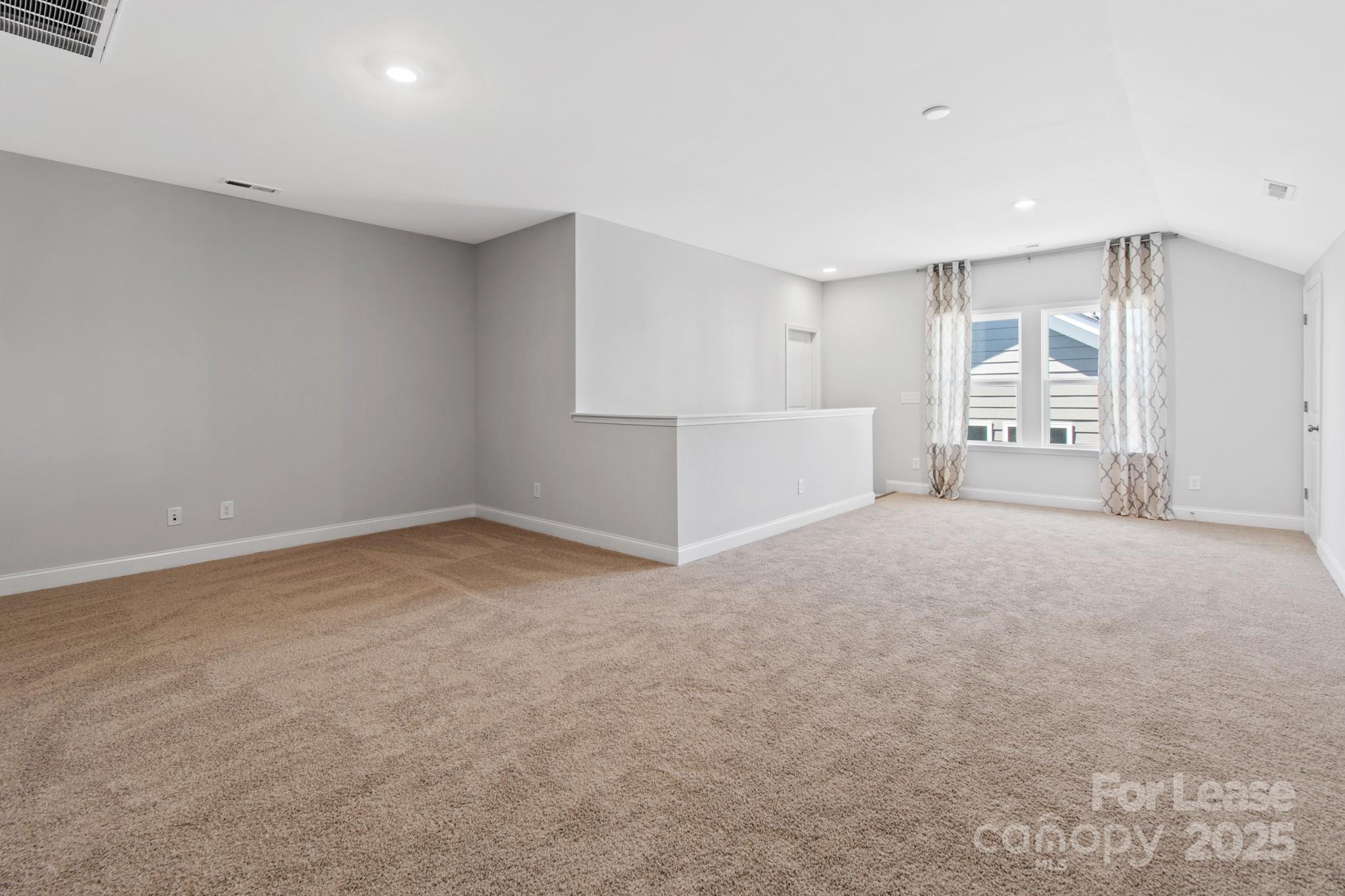 17118 Sand Bank Road Charlotte, NC 28278 - Photo 25 of 37 a view of an empty room with a window