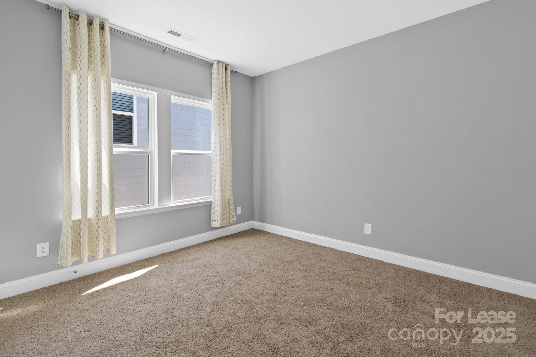 17118 Sand Bank Road Charlotte, NC 28278 - Photo 27 of 37 a view of an empty room with a window