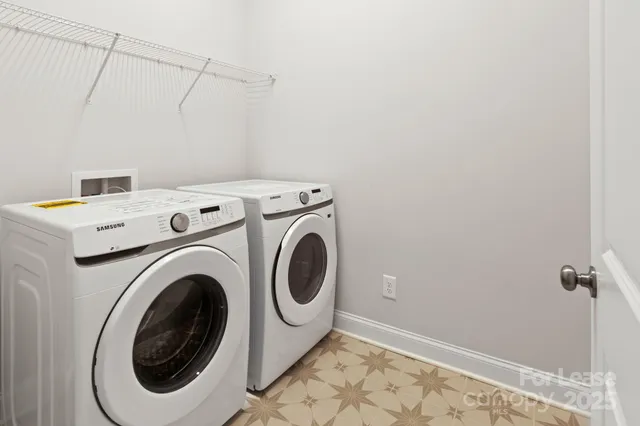 a view of a house with a wooden deck