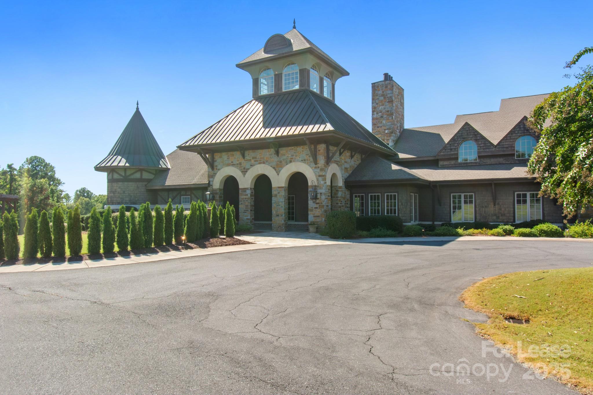 17118 Sand Bank Road Charlotte, NC 28278 - Photo 33 of 37 a front view of a house with a yard and garage