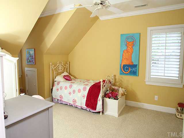 3303 Ruffin Street Raleigh, NC 27607 - Photo 20 of 25 a bedroom with a bed and window