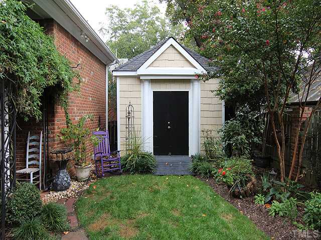 3303 Ruffin Street Raleigh, NC 27607 - Photo 25 of 25 a front view of a house with a garden