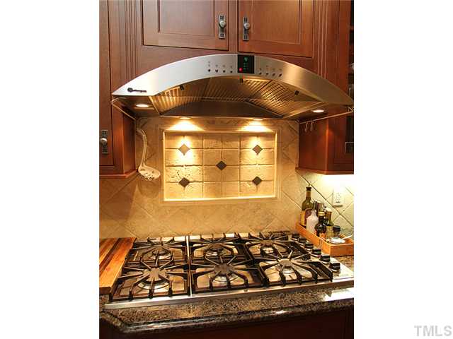3303 Ruffin Street Raleigh, NC 27607 - Photo 7 of 25 a bathroom with a granite countertop sink and a stove