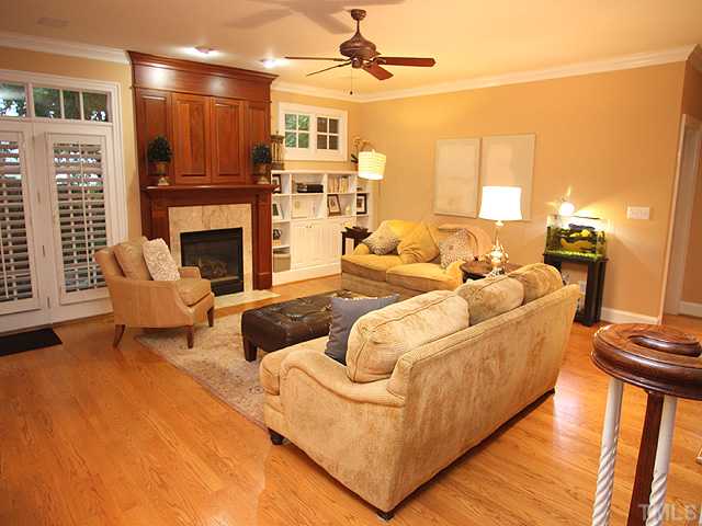 3303 Ruffin Street Raleigh, NC 27607 - Photo 9 of 25 a living room with furniture and a fireplace