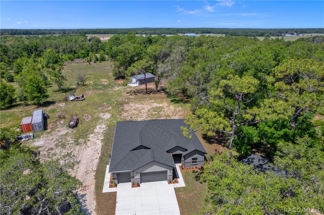 4530 South Florida Avenue Inverness, FL 34450 - Photo 96 of 100 an aerial view of a house with yard swimming pool and outdoor seating