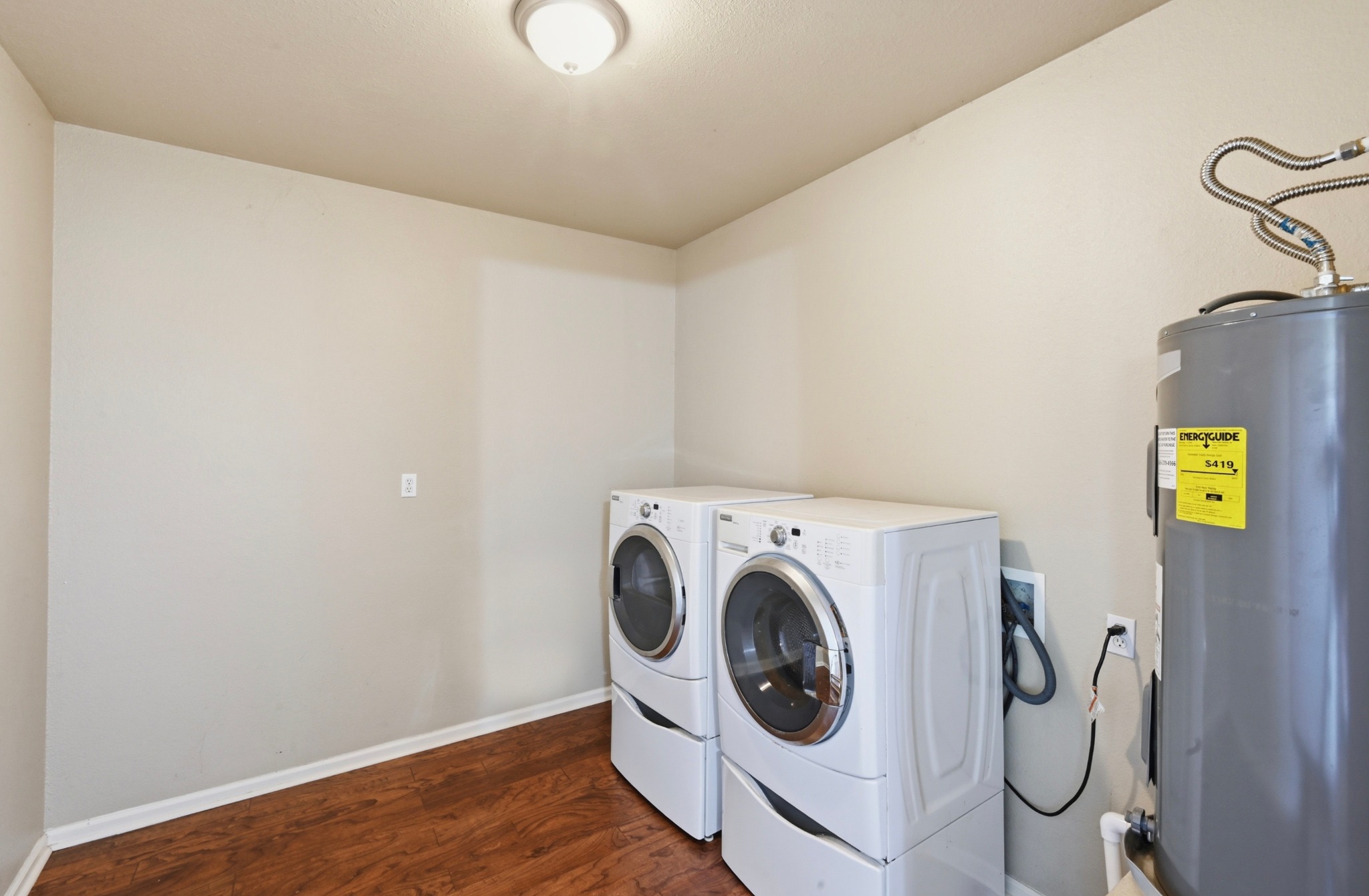 1127 Parr Street Luling, TX 78648 - Photo 14 of 20 Functional laundry room equipped with modern appliances for effortless household tasks.