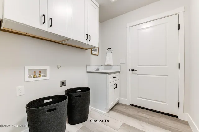a view of storage and utility room with washer and dryer