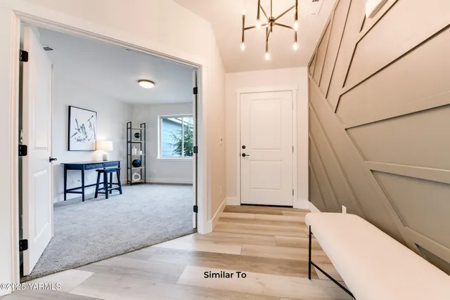 a spacious bedroom with a bed and a table