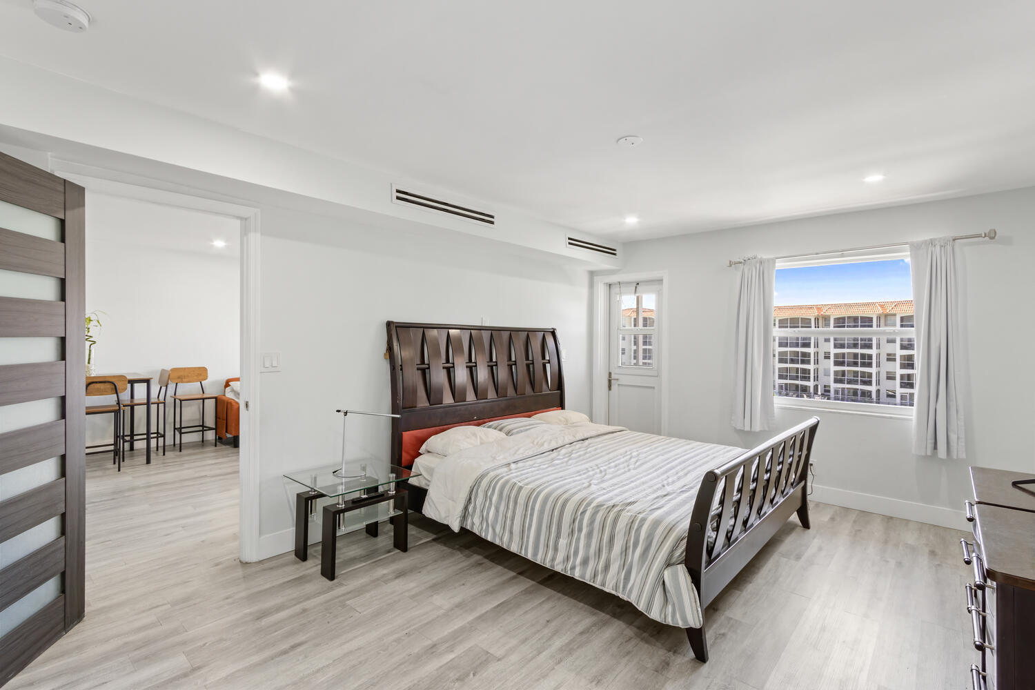 2871 North Ocean Boulevard, Unit V443 Boca Raton, FL 33431 - Photo 20 of 49 a bedroom with a bed a table and chair