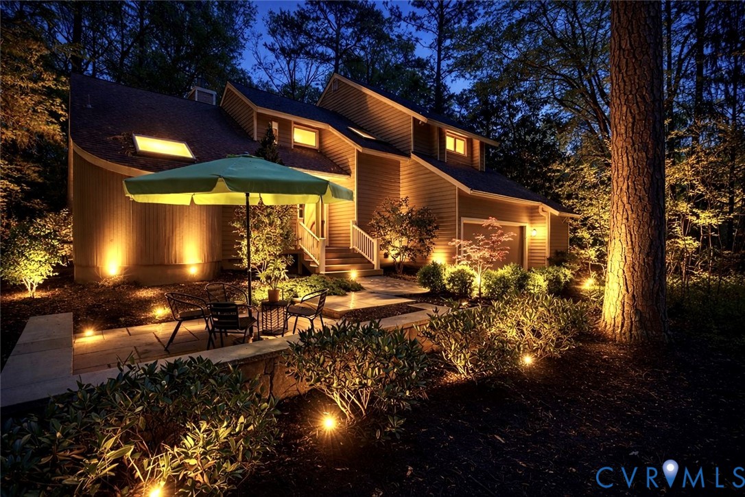 2701 Spring Gate Place Midlothian, VA 23112 - Photo 1 of 65 Back of house at night with a patio, outdoor dinin