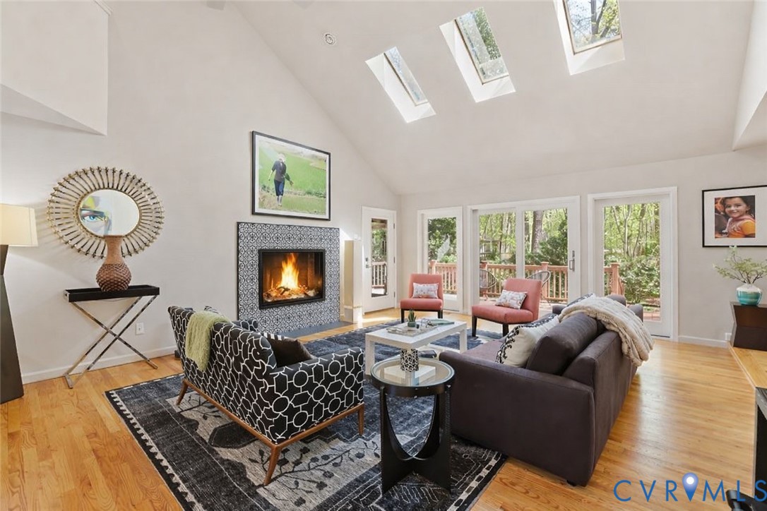 2701 Spring Gate Place Midlothian, VA 23112 - Photo 23 of 65 Living area with a tile fireplace, light wood-styl