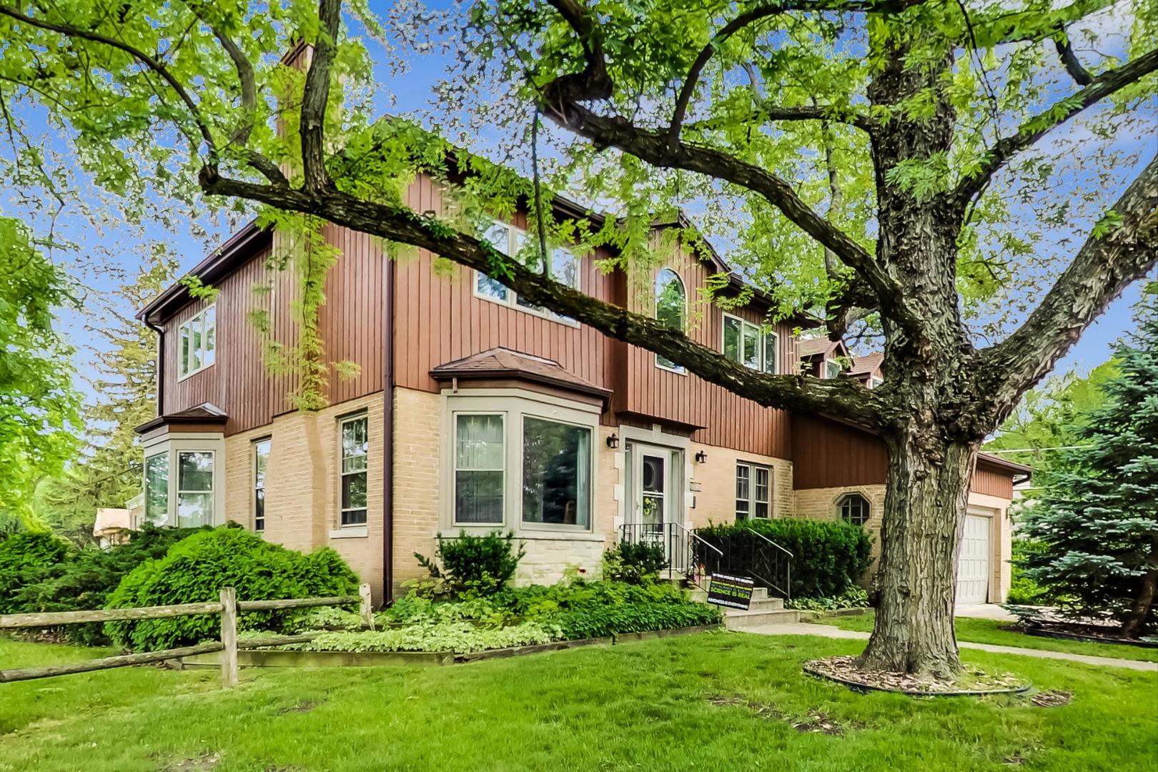 701 South Seminary Avenue Park Ridge, IL 60068 - Photo 2 of 60 a front view of a house with a yard and trees