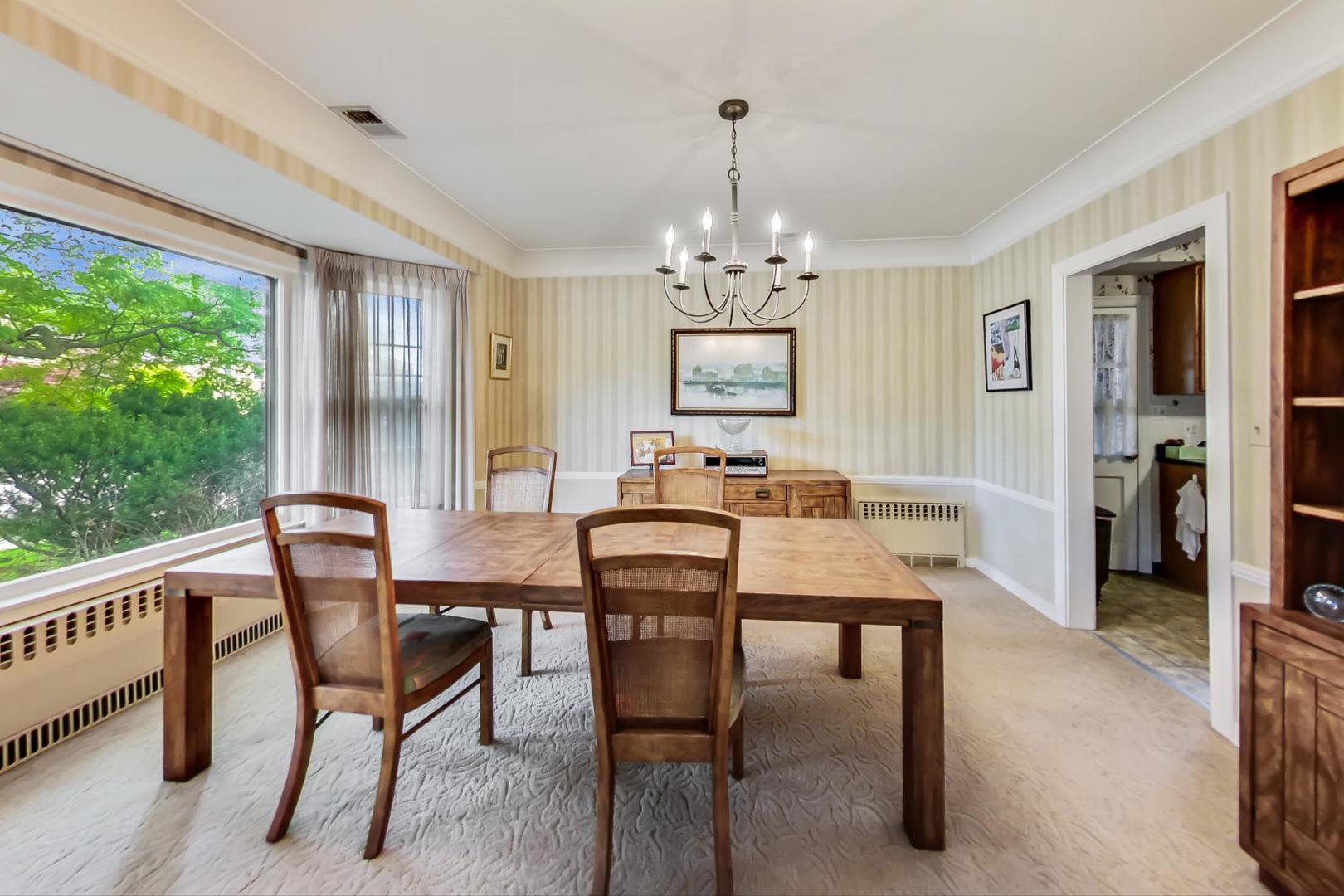 701 South Seminary Avenue Park Ridge, IL 60068 - Photo 11 of 60 a view of a dining room with furniture window and outside view