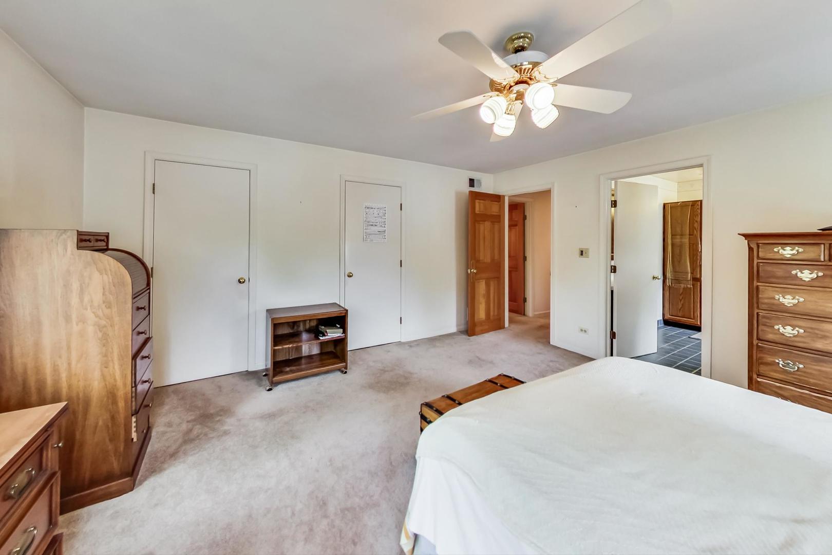 701 South Seminary Avenue Park Ridge, IL 60068 - Photo 29 of 60 a bedroom with a bed and a chandelier