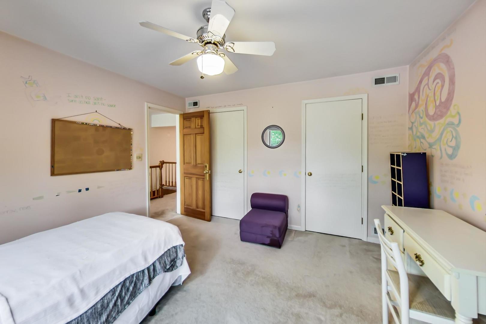 701 South Seminary Avenue Park Ridge, IL 60068 - Photo 33 of 60 a bedroom with a bed and a flat tv screen on dresser