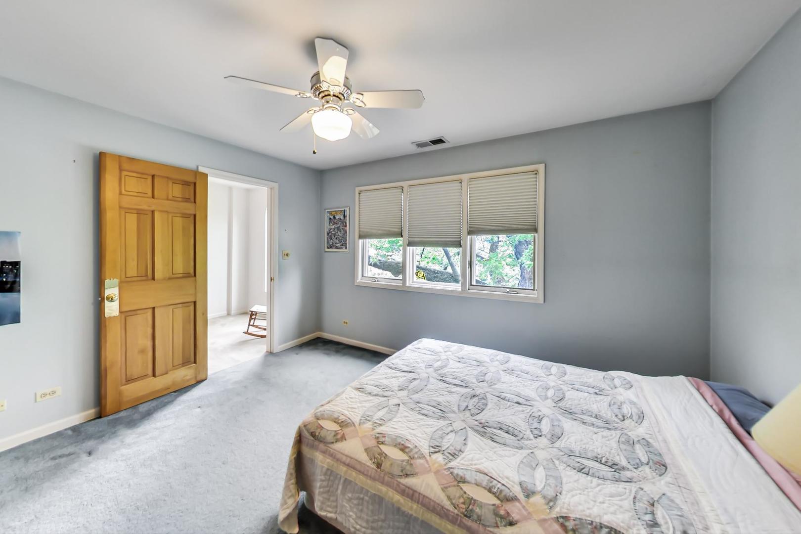 701 South Seminary Avenue Park Ridge, IL 60068 - Photo 35 of 60 a bedroom with a bed and a window