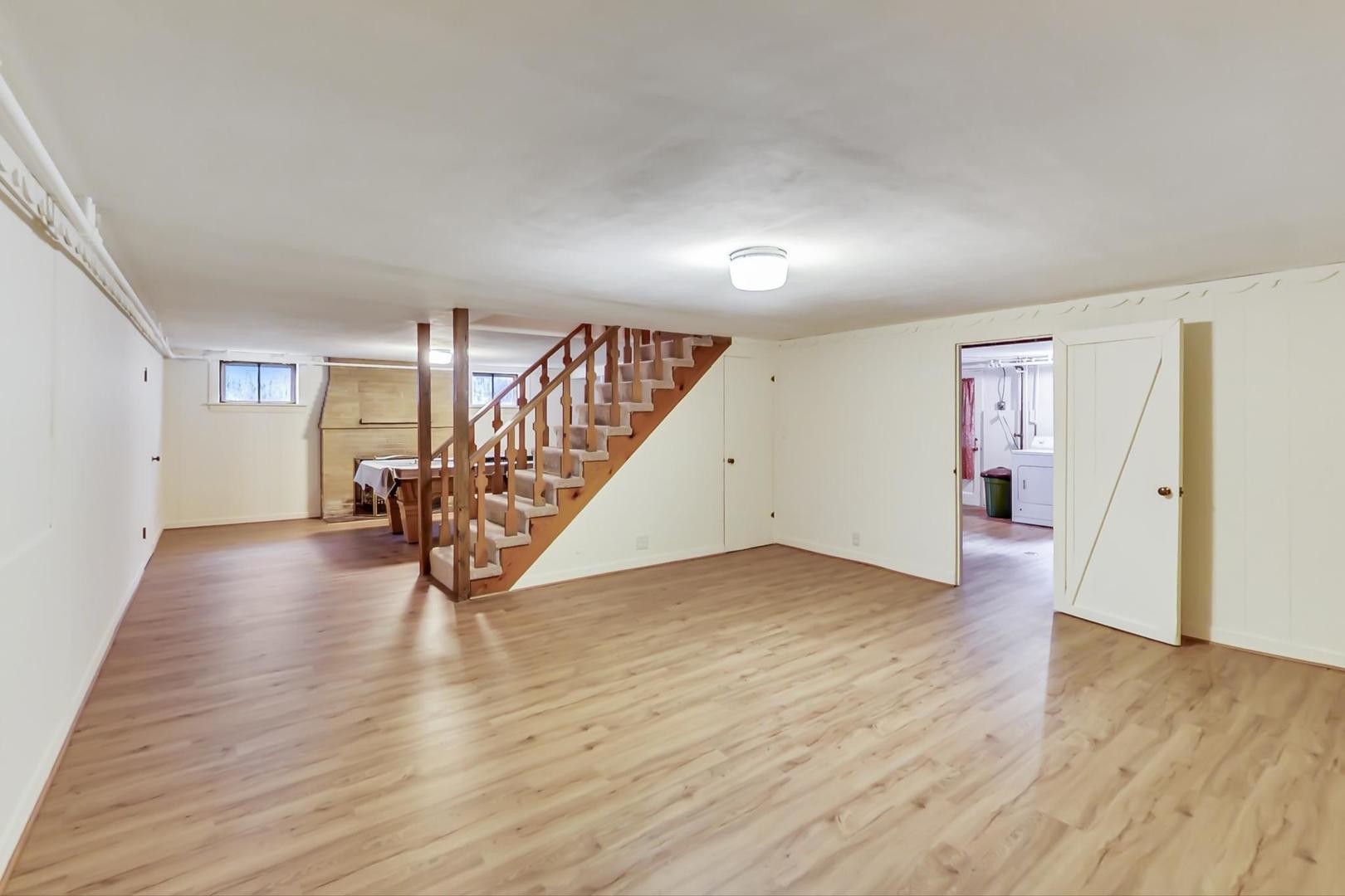 701 South Seminary Avenue Park Ridge, IL 60068 - Photo 43 of 60 an empty room with wooden floor and stairs