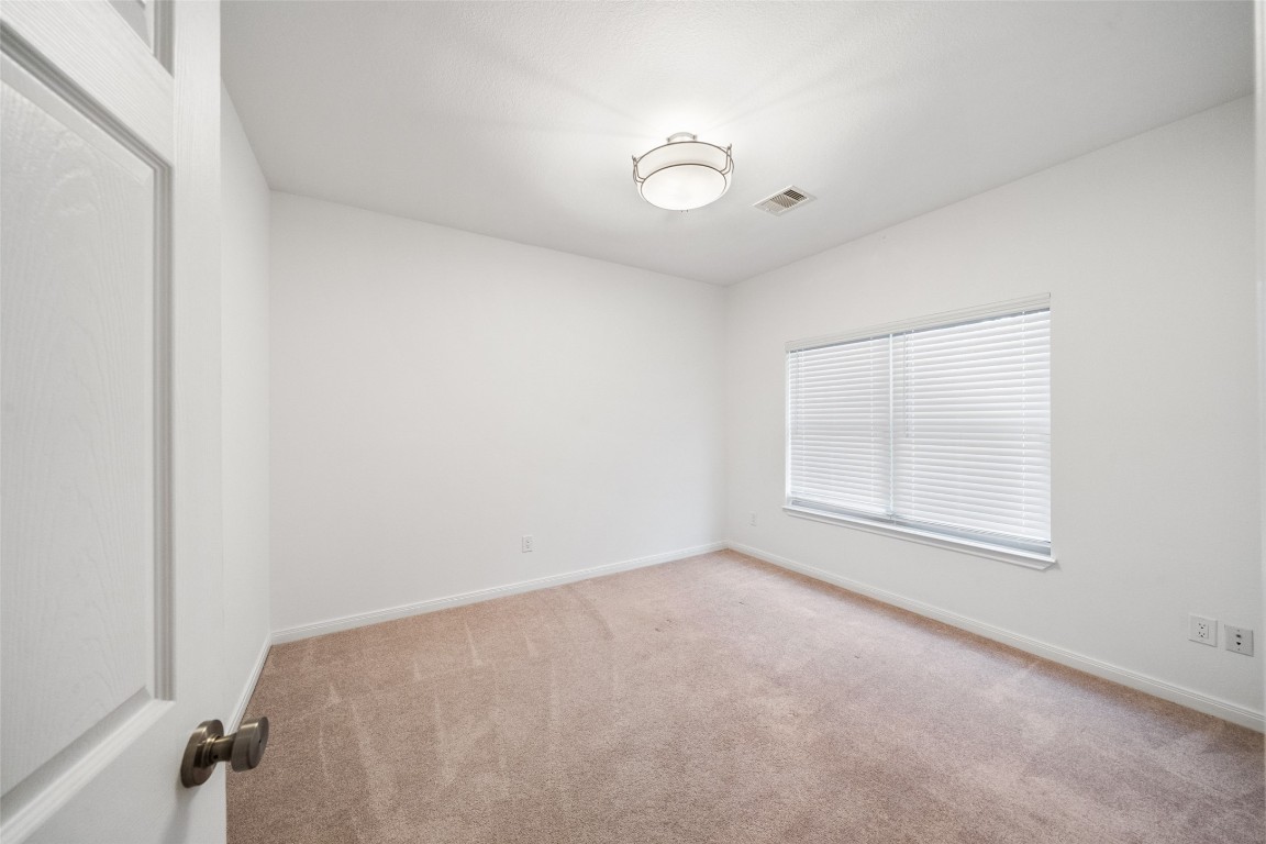 110 Lords Circle Coldspring, TX 77331 - Photo 16 of 34 an empty room with a empty space and windows