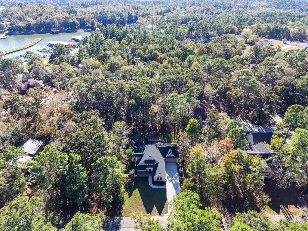 110 Lords Circle Coldspring, TX 77331 - Photo 26 of 34 an aerial view of a house with a yard and lake view