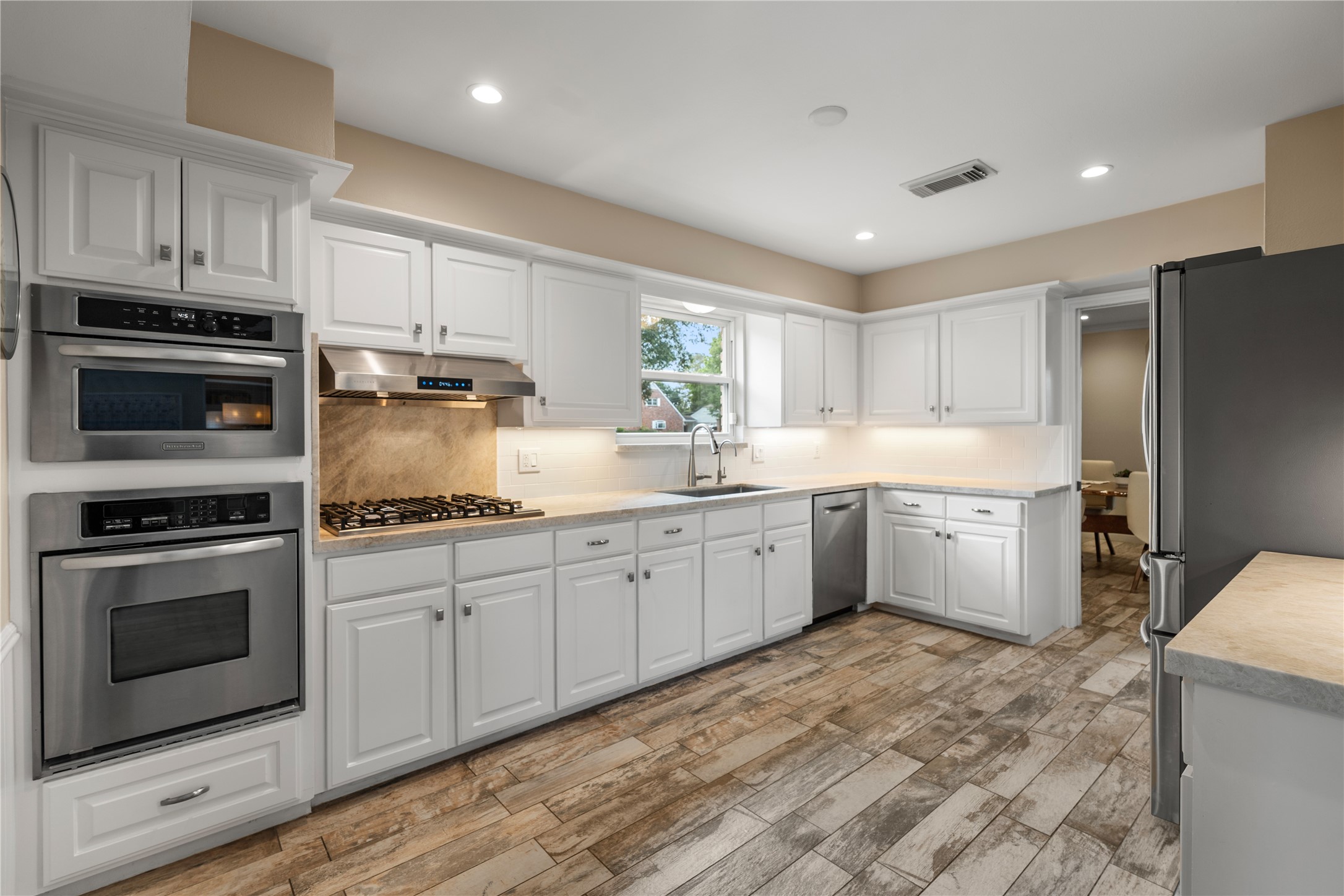 14219 Apple Tree Road Houston, TX 77079 - Photo 9 of 33 Kitchen with Taj Mahal quartzite countertops