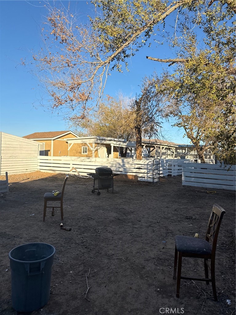 16100 Navajo Road Apple Valley, CA 92307 - Photo 35 of 55 a view of a patio with table and chairs