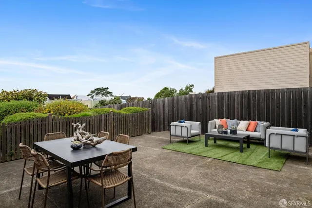 a backyard of a house with seating space