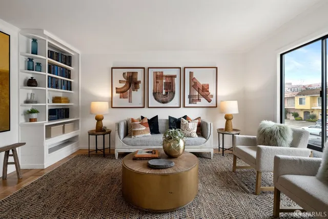a living room with furniture and a window