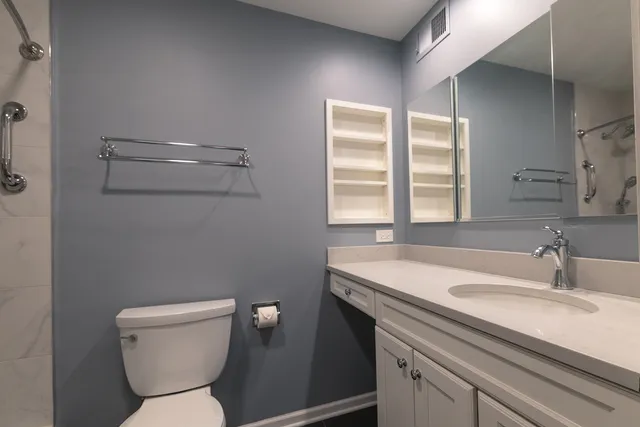 a bathroom with a bathtub a toilet and a shower