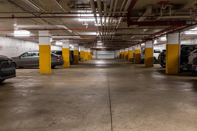 a view of a bench with wooden fence