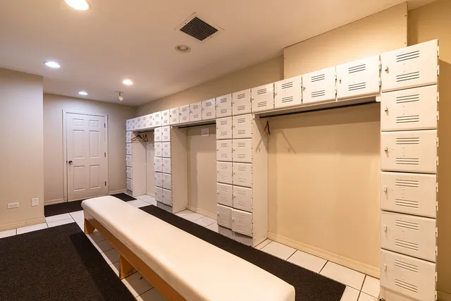 a room with gym equipment and a view of living room