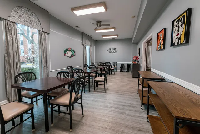 a room with pool table and wooden floor