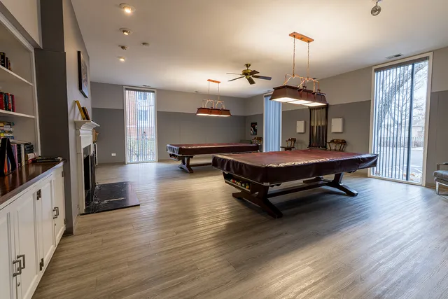 a bedroom with furniture and a fireplace