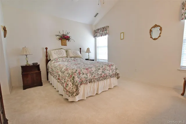 a bedroom with a bed and a cabinets