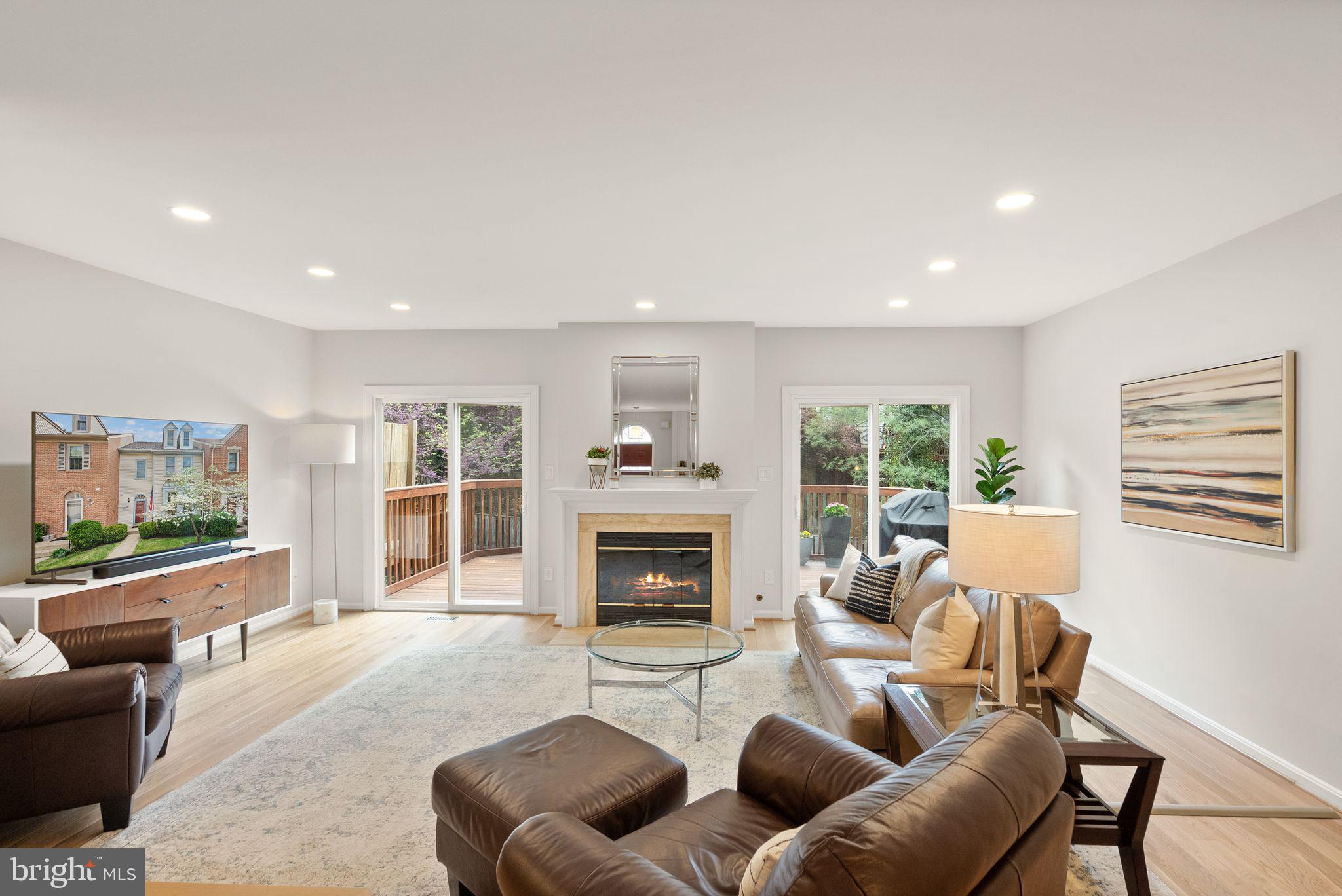 6369 English Ivy Way Springfield, VA 22152 - Photo 7 of 62 a living room with furniture and a fireplace