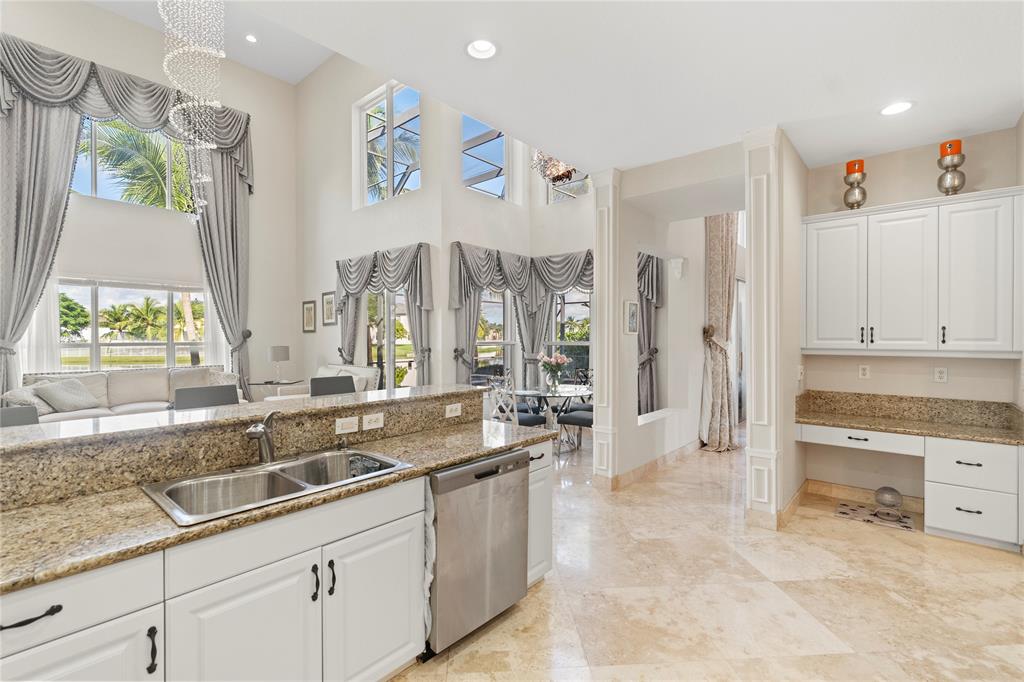 4622 Southwest 185th Avenue Miramar, FL 33029 - Photo 16 of 64 a large white kitchen with a large window